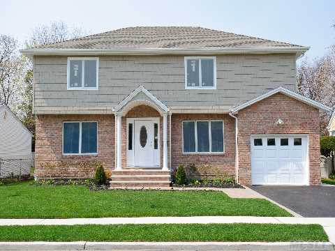 Just Listed!  Newly Constructed From The Ground Up.  8 Room Colonial With 4 Bedrooms, 2.5 Baths, Beautiful Kitchen With Raised Panel Cabinetry And Granite Countertops.Mid-Block Location, Low Taxes.