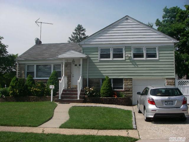 Well Maintained Split,  Newer Kitchen W/Granite Counters, Ss Appliances & Oak Bleached Cabinets,  Newer Full Bath W/Large Jacuzzi,  Newer Hot Water Tank,  Two Levels Of Gleaming Wood Floors,  Sliders To Rear Deck Off Fdr,  Lots Of Closets,  Quiet Street,  Close To All-Including Lirr. Star Ex. $1336.40- New To Market