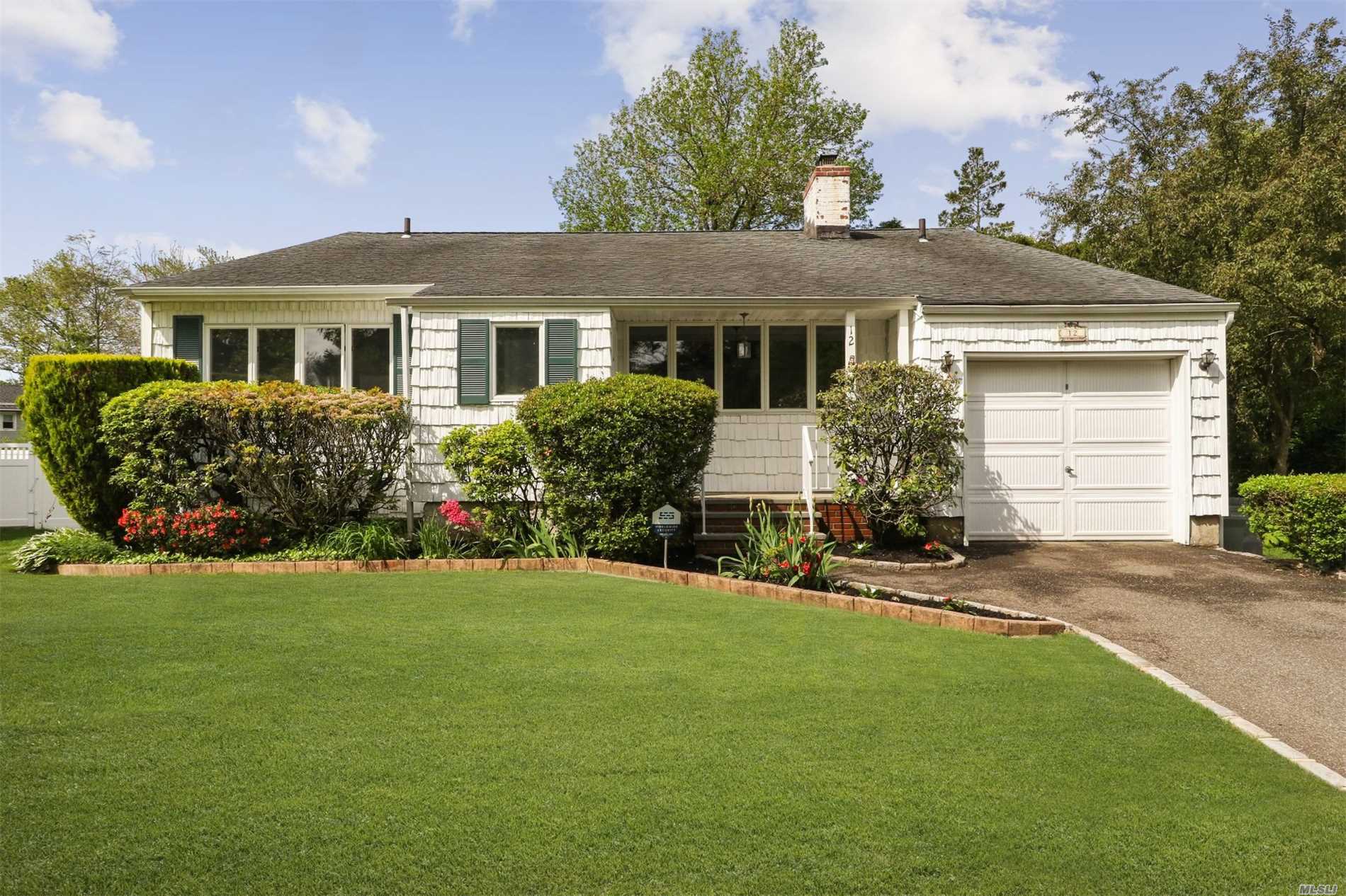 Fabulous front to back split!! 2 Fireplaces!! Gleaming hardwood flooring!!Vaulted ceiling in Living room with exposed beams!! New banister, paver patio, new doors, new oil tank, new powder room, sprinkler system, alarm system, interior street, mid-block location...Make this your new home