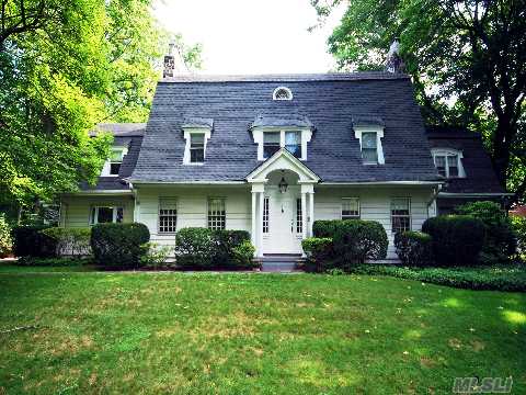 Fabulous Center Hall Colonial With Old World Charm. Seven Family Bedrooms, Four And A Half Baths. First Floor Has Large Living Room With Fireplace Opening To Library And Exercise Room. Large Family Room With New French Doors Which Opens To Large Flat Property. Four Car Garage. Alarm, Central Air Conditioning, And New Gas Heat.