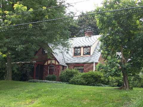 Rare Opportunity! Legal 2 Family On Extra Large 100X187  Classic Brick Tudor With Slate Roof, Charm & Architectural Details. This House Has Great Potential And Is Priced To Sell!!Being Sold In As Is Condition. Near Beach & Preserve!! 