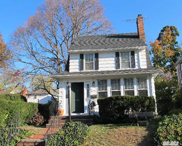 Charming Sunny Colonial On The Queens/Nassau Border. Residents Can Use The Gn Sth Lakeville Elem & Gn Sth Middle & High Schools. Section Of Property In Queens And Section In Nassau.  Formal Lr & Dr. Den,  Lge Eik With Doors To Backyard.  Side Entrance To Basement.  Few Blocks To Lirr. N-21 Bus Stops On The Corner Of Glenwood & Northern Blvd.