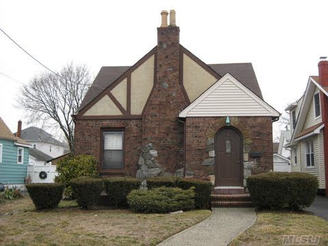 This Is A Beautiful Tudor Cape A Mid-Block Location , With A Large Living Room, A Stone Fireplace Formal Dining Room. It Also Has An Updated Eat In Kitchen  And 4 Bedrooms, 2 Full Baths And A 2 Car Garage. 