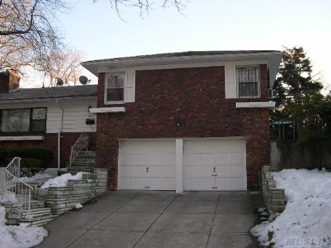 Spacious  Brick Split With 3 Bedrooms,2 Bathrooms,Marble Floors In Foyer & Hallways,  Marble Fireplace, 2 Car Garage.