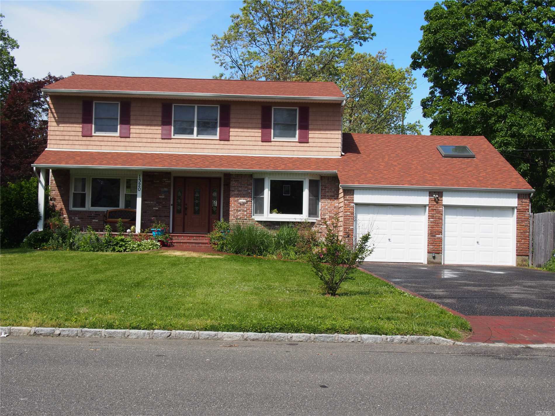 Oversized Center Hall Colonial Offers Hardwood Floors Throughout, Master Br Suite, Updated Baths, Large Den & Office W/Vaulted Ceilings & Skylight, Formal Living & Dining Rooms, Full Bsmt. New Roof! New Burner! Updated Electric.