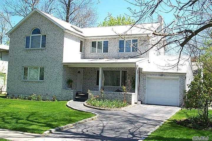 Mag Brick Colonial set on 7600 SqFt Prop.Lite and Brite, This 4 Bd, 2 Full and 2 1/2 Bth house has it all! The wooden staircase floats up to the 2nd fl and down to the finished Bsmt. 2nd Fl has Huge Cath Mastr Suite with large custom Bth, plus 2 more Bd and 1 Full bath. 1st Fl has addditional bedroom and 1/2bth, Large Den, LR, DR and EIK complete this lovely home.Baker Ele, North Middle and High.Spec Feat: Lalique Type Glass Panels, Wood Floors, Updated Windows and Baths, CAC, Gas Heat. LIRR Park Permit.