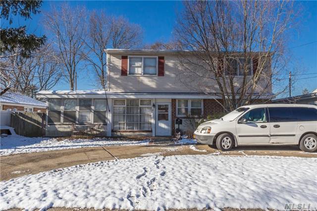 Move-In Condition Over 2000 Sq Ft 5 Bdrm 2 Updated Baths Mid-Block Colonial Conveniently Located. Large Rooms, Plenty Of Storage. Lr, Fdr, Eik, Den, Det. Garage, Possible Mother/Daughter W/Proper Permit.