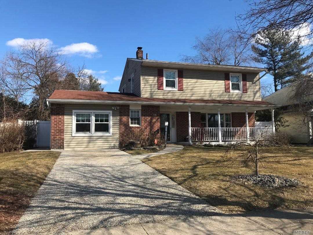 Spectacular Colonial For Sale In Hicksville. Move In Condition, 2054 Int Sq. Ft. Beautiful Open Front Porch, Large Family Rm, Possible 4th Bdrm, 1.5 Baths On 1Sr Flr, Updated Kitchen W/Large Dining Area. Corian Counter-Tops, Porcelain Tile Flrs, Wine Fridge, Double Oven, Large Deck On 2nd Flr W/Back Staircase, Covered Fieldstone Patio, Quiet, Private Back Yard, 1.5 Mi. To Hicksville Train Station.