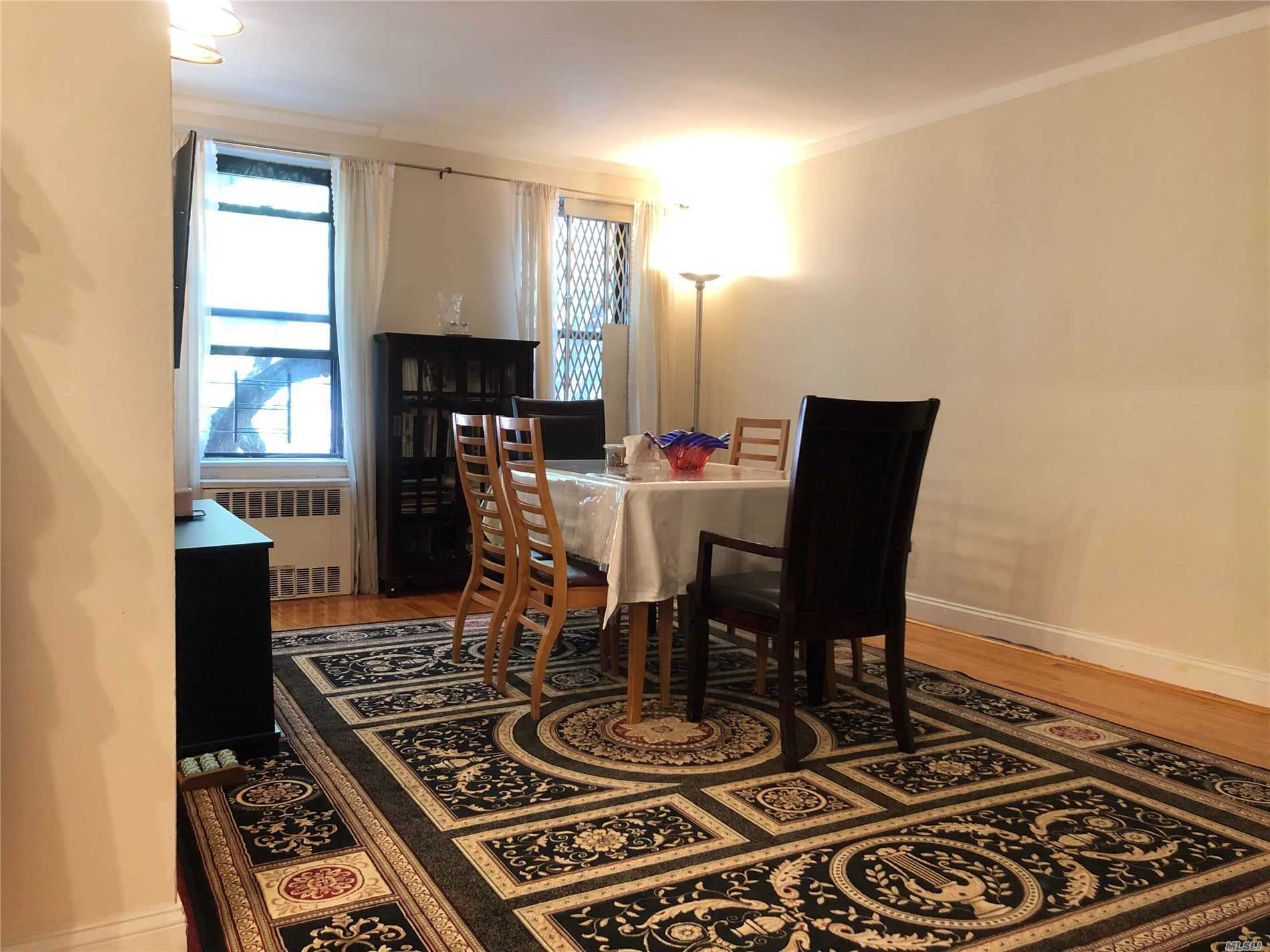 Spacious One Bedroom Apartment with large foyer, plenty of storage, hardwood floors and windows in every room. Building well maintained with live-in super, porters and laundry room. $583.98 maintenance INCLUDES electricity. Convenient to trains, buses, shopping, restaurants, etc