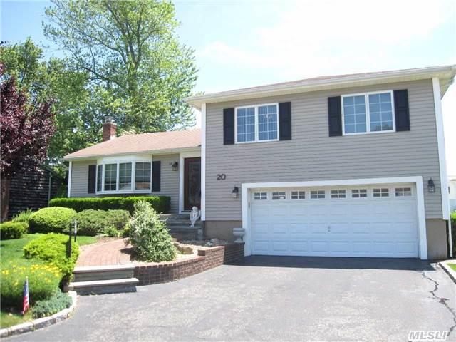 Magnificent Plainview Split In Bethpage School District. This Home Boasts And Expanded Eik With Breakfast Area, Granite Counters And New High End Ss Appliances, 80 Gallon Hw Heater W/ Gas Heat, Gleaming Hardwood Floors, Anderson Windows, Cac, 3 New Baths, Newly Finished Basement. Enjoy The Days Of Summer On Your Screened Porch. Possible M/D W/Permits.