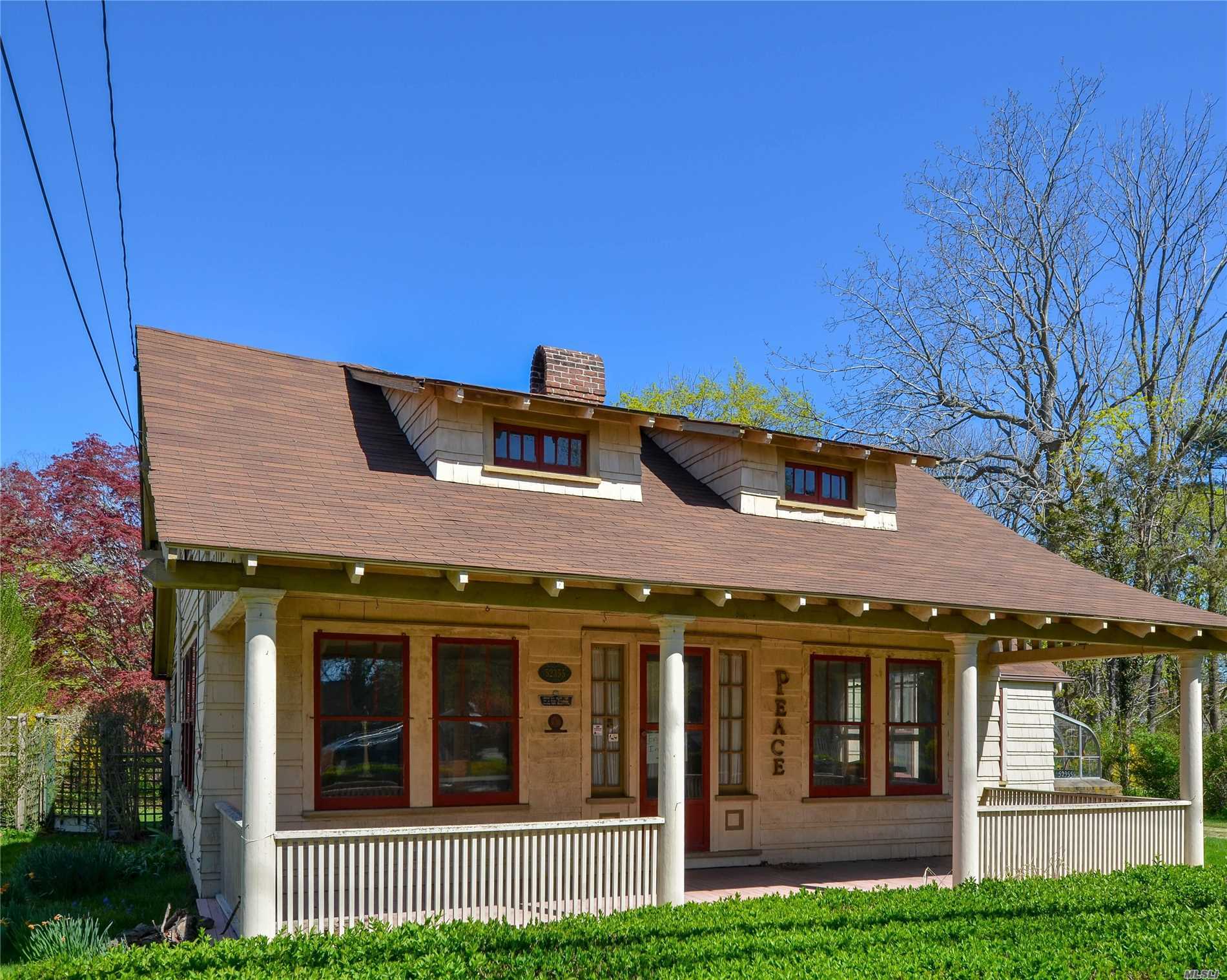 Historic home in the heart of Southold. Old charm waiting for your touches. Hardwood floors, oversized wood burning fireplace, greenhouse, and a front porch. Garage and 3 additional buildings.