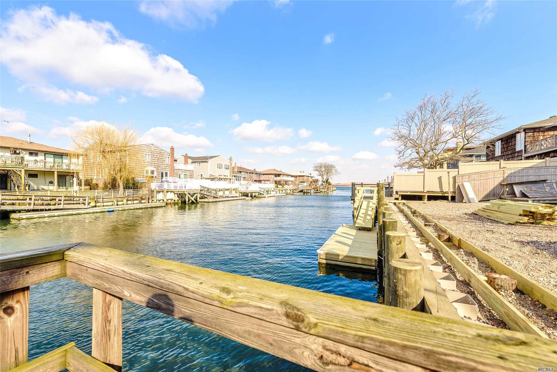 Lido Beach. Large Waterfront 5 Bedroom, 3 Full Bath Colonial, Large Eat In Kitchen, Huge Great Room With Fireplace. Master Suite With Huge Closet, Dressing Area, Full Bath, And Sauna. Porch Deck And Patio.