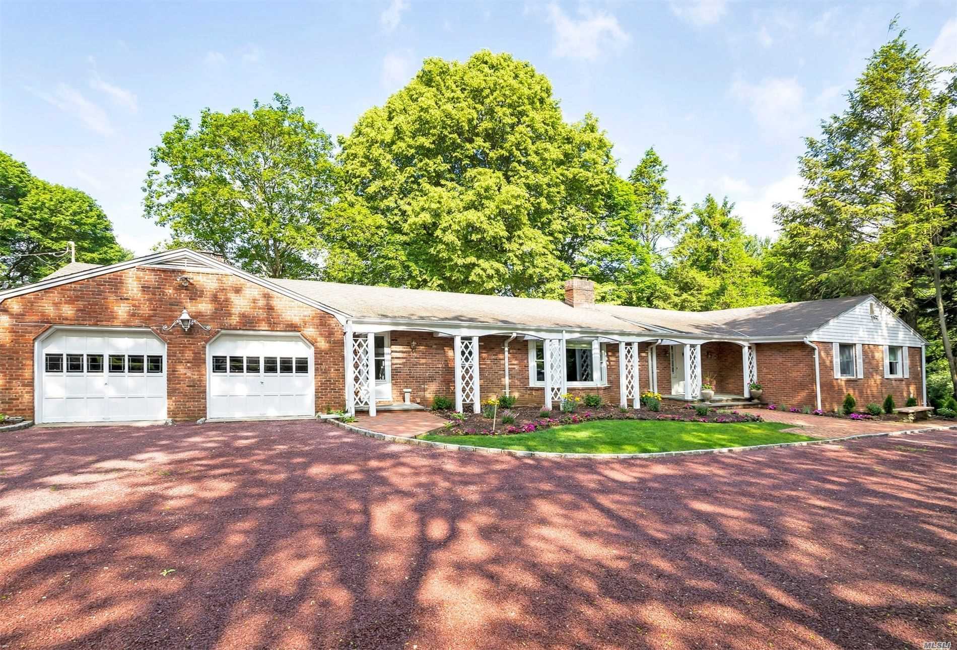 Majestic And Mature Park Like Property Just shy of 4 Acres Custom Built Mid Century Modern Sprawling Brick Ranch With Over Sized Rooms All with Views of Property Automatic Whole House Generator Perfectly Located In The Prestigious North Shore Schools