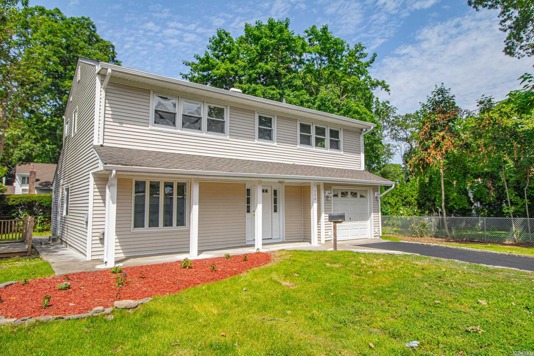NEW NEW NEW! What A Find! Huge Colonial with TWO Living Rooms, New Kitchen, New Bathrooms, New CAC, New Heating System, New Hardwood Floors, New Sealed Driveway, Too Much Too List! Must Come! Will Go Fast!!