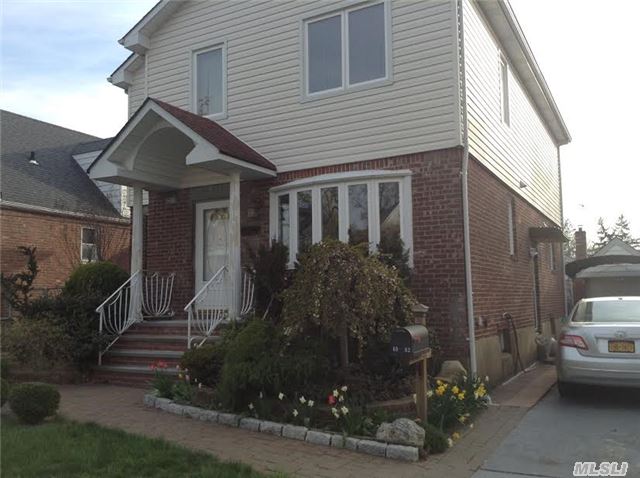 This Expanded Brick/ Aluminum Colonial Has Been Completely Renovated. Four Bedrooms,  2 1/2 Bath Detached Garage Front & Backyard,  Pvt Driveway,  Bay Window,  Wood Floor, Spacious Bedrooms,  Full Finished Basement.