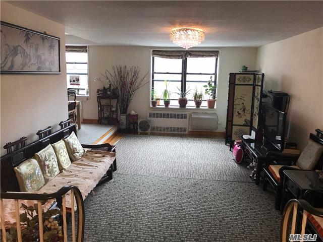 Extra Large Southern Exposure Unit Located In Heart Of Downtown Flushing. Spacious L Shape Livingroom Creates Separate Dining Area Right Next To The Kitchen. Hardwood Floor Throughout, Upgraded Marble Kitchen & Bathroom, Plenty Of Closets.Low Monthly Charges Include All But Electricity. 24 Hour Doorman Security, New Elevators, Roof & Laundry Appliance. Short Distance To All