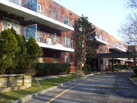 Renovated, Sunny, Top Floor One Bedroom With 'L' Shaped Living Room/Dining Room, Renovated Kitchen And Bath, Bedroom, Terrace.  The Building Has Adoorman, And Dock On Manhasset Bay.  Can Get A 2nd Parking Spot.