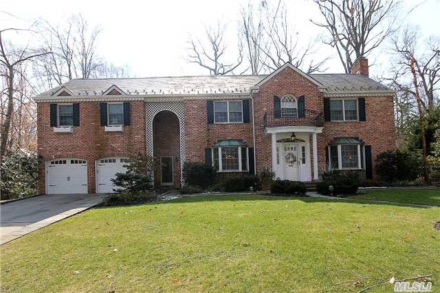 Classic And Elegant All Brick Center Hall Colonial On A Park Like Street In Flower Hill. Large Principle Rooms. Lr With Fireplace, Formal Dr, Kitchen, Family Room W Fire Place, Master Bedroom W Full Bath. Wide Hallway Leads To 4 Bedrooms And 2 Full Baths That Complete Second Floor. Finished Basement With Laundry And Playroom. Move In Ready!