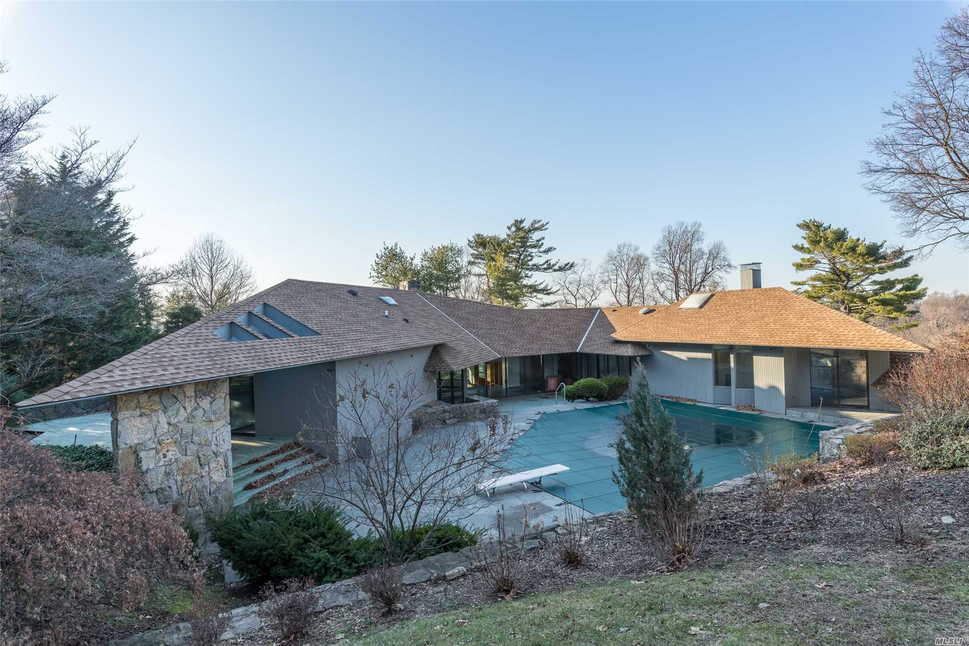 This Multilevel One Of A Kind Norman Jaffe House Has An Open Floor Plan And Features Outdoor Decks From Each Room. This 1.25 Acre Property Features Manicured Lawns And An Inground Swimming Pool. The Home Is Host To 6 Bedrooms And 5.5 Bathrooms And A Finished Basement.