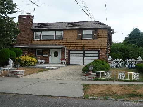 Charming Semi-Detached 2 Family Features A Large 2 Bedroom Unit With Oak Floors, Fdr Over A 1 Bedroom Unit. The 1st Floor Offers An 'Extra' Room, Perfect For A Home Office, Updated Gas Heat & Windows, 100 Amp Electric, Spacious Yard, Private Driveway. Near Shops On Bell Blvd Or The Lirr. Great Sd # 26 P.S. 41, M.S. 158.