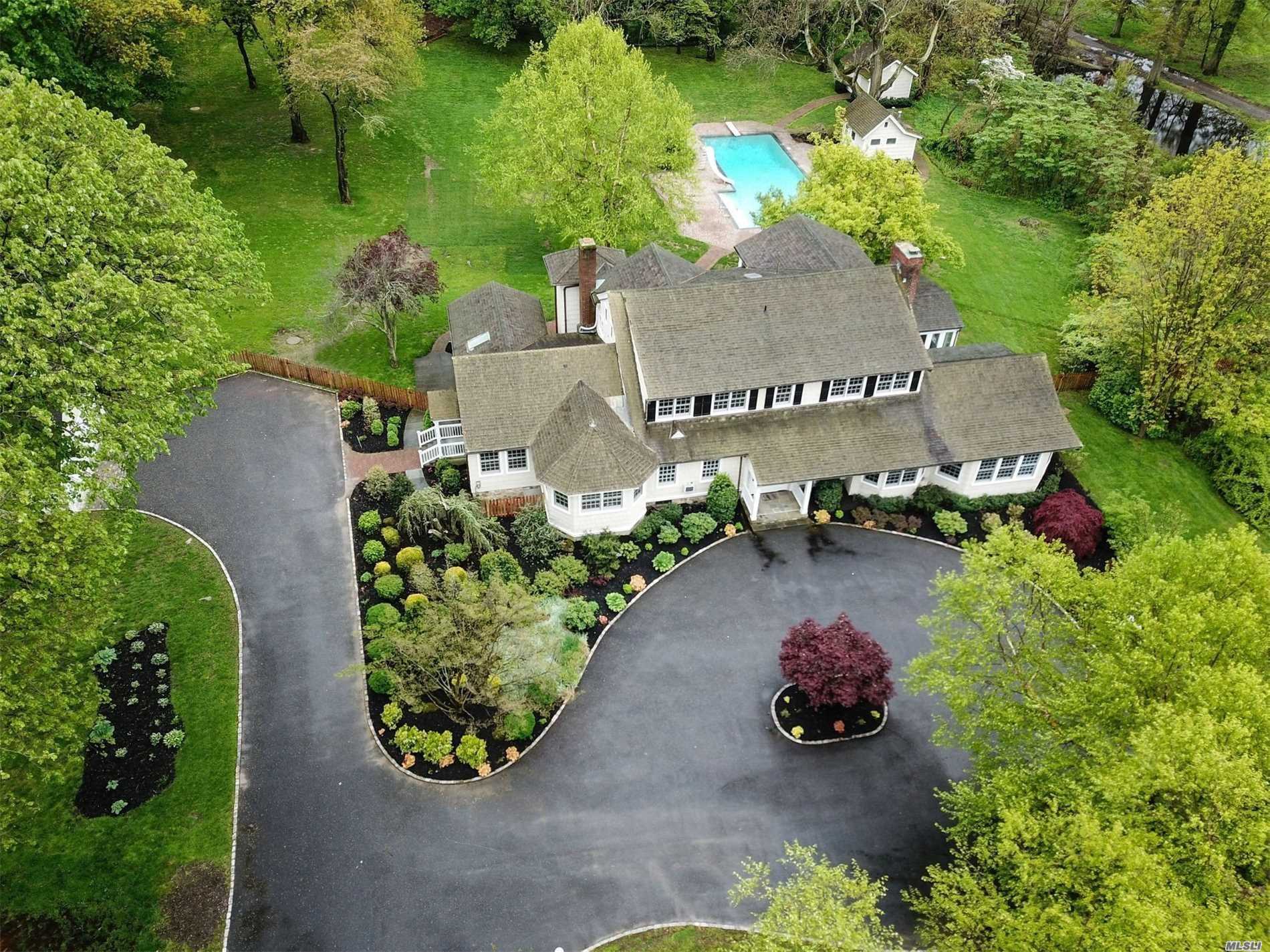 Magnificent wood beams and hardwood floors throughout this 5005 sq. ft home on a sprawling 4.31 acres with IG pool and cabana. Wonderful flow for entertaining with banquet size dining room. Chef&rsquo;s kitchen with gas cooking, storage galore and screened in patio. Bedroom/guest suite on first floor. Three wood burning fireplaces. Two 2 car garages, house generator and so much more. Possible to divide with proper permits. Survey and floor plan attached.