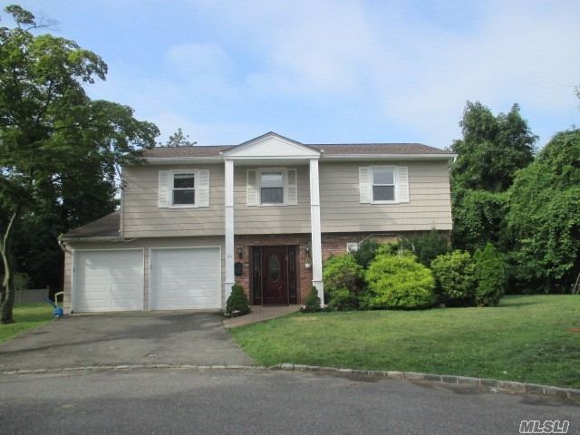 Beautifully Renovated Sundrenched Splanch tucked away on a quiet cul-de-sac. Huge Entry Hall leads to Formal DR, EIK LR as well as laundry rm and powder Rm Sliding Doors lead to an inviting backyard with patio and side yard . Huge Family Rm with cathedral ceilings leads up to master suite, hallway bathroom w/ tub and 3 Brs. Wood flrs throughout. Part Fin Bsmt.. house has solar panels which reduces electric bill. JFK Elem, North Middle/High Schls. Near shops, parks, worship & transportation