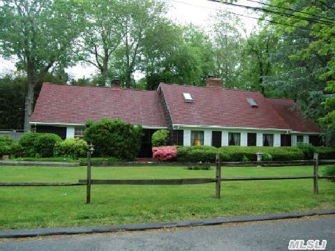 Lovely Country-Style Home. Mature Trees,  Convenient To Lirr. Professional Landscaping. Beamed Ceilings In Lr/Lib, Open Floor Plan, Granite Kitchen With Stainless Appliances. French Doors To Stone Patio. Tool Shed. Prospective Purchasers To Verify Taxes And Info.