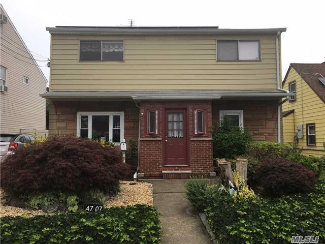 Beautiful One Family Home In Flushing. First Floor - Living Room, Eat In Kitchen, Two Bedrooms & Full Bath. Second Floor - Living Room, Galley Kitchen, Two Bedrooms & Full Bath. Private Driveway.