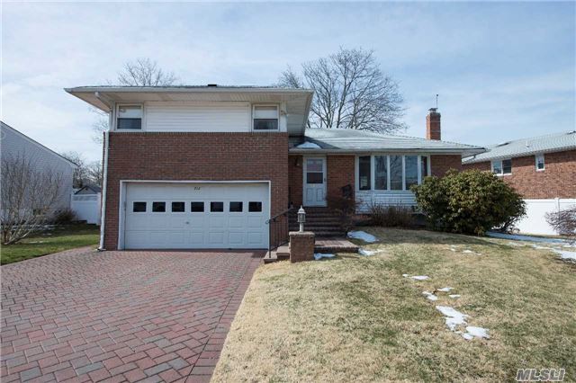 Large 3 Bedroom Split Close To South Grove Elementary, Syosset Library And All Parkways. Wood Floors, Sun Filled Eat In Kitchen, Large Dinning Room And Lower Level Den With Additional Basement. Nice Size Lot With Deck.