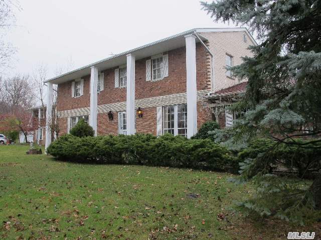 Spacious Brick Center Hall Colonial In Desirable Flower Hill Area Of Port Washington. Sky-Lit 2 Story Entry Foyer,  Formal Lr & Dr,  Den With Fireplace & Doors To Patio,  Lge Eik With Sliding Doors To Patio,  Large Master Br With Balcony. 100X150 Park-Like Grounds. Laundry Room Off Kitchen. Roslyn Schools #3.