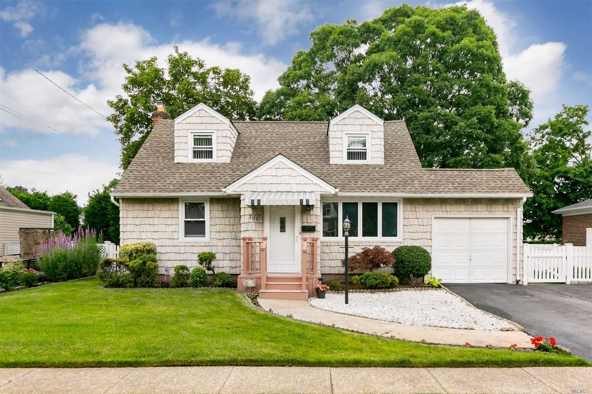 Beautiful Back Dormered Cape features Large Expanded Eat-In Kitchen with Stainless Appliances and 8&rsquo; Sliding Glass Andersen Doors leading to yard, Newer Roof (2012), New HW Heater (2016), IGS, 1.5 Attached Garage, Lovely Yard with Deck & Covered Patio,  Move in Condition.