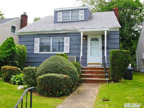 Charming Cape On 40X100 Property Near The Bay Terrace Shopping Center. Spacious Living Room,  Dining Area,  4 Bedrooms,  2 Full Baths,  Eat-In-Kitchen & Basement. You Will Have The Luxury Of Express Bus To The City,  Long Island Rail Road & Local Bus Services.