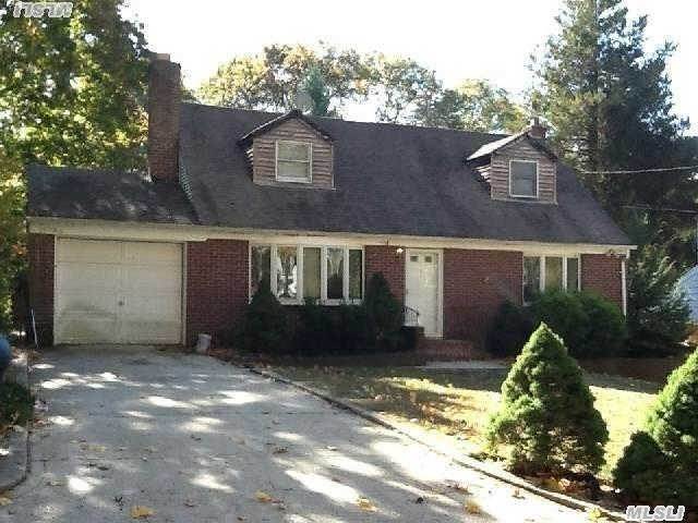 Spacious Cape.  Needs Tlc. Partially Finished Basement With Fireplace. Two Driveways.