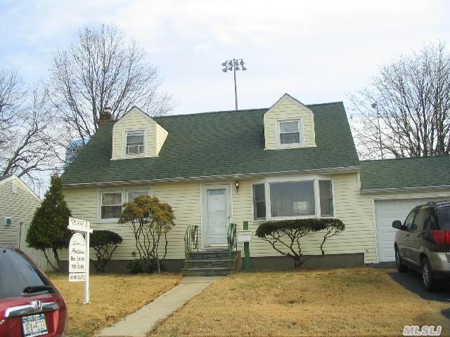 This Expanded Cape Features 4 Bedrooms,  2 Full Baths,  Kitchen W/ Gas Cooking And Granite,  Livingroom,  Dining Area,  Rear Dormer,  Full Partially Finished Basement. 150 Amp Electric,  Location In North Hicksville. Attached 1.5 Car Garage And A Rear Deck. Taxes Do Not Reflect Star Exemption.