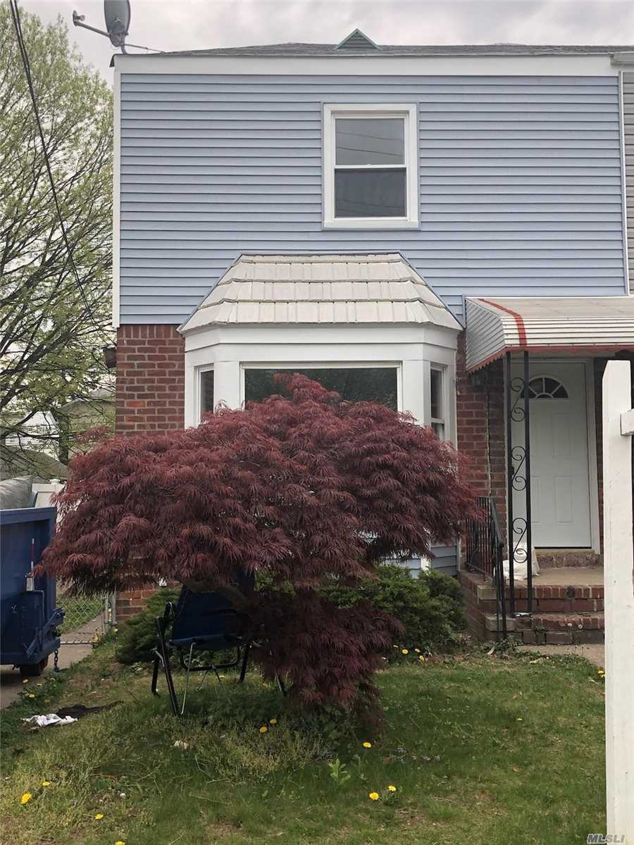 Completely Renovated Colonial In Cambria Heights, New Wood Floors Throughout, Updated Kitchen, Updated Bathrooms, New Siding & New Appliances. Wonderful Neighborhood & Close To All. A Must See!
