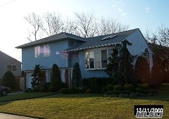 Beautiful Split Minutes Away From Dining, Shopping, Lirr And South Shore Beaches. This 3Br 2Bath Split Offers A Large Den Off Attached Garage With Rear Deck. 2nd Level Features Vaulted Ceiling In Living Room / Formal Dining Room & Spacious Eik. Hardwood Floors Throughout. Clean Move-In Condition.