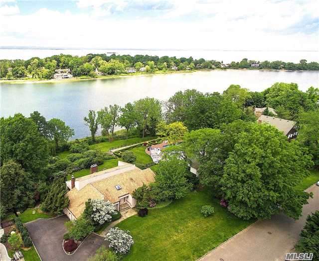 Stunning Waterfront Property Situated On Almost 1 Acre Of Perfectly Manicured Land With Unobstructed Water Views. The Home Features A Generous Master Bedroom Suite With Master Bath, Walk In Closets And Terrace Overlooking The Water.