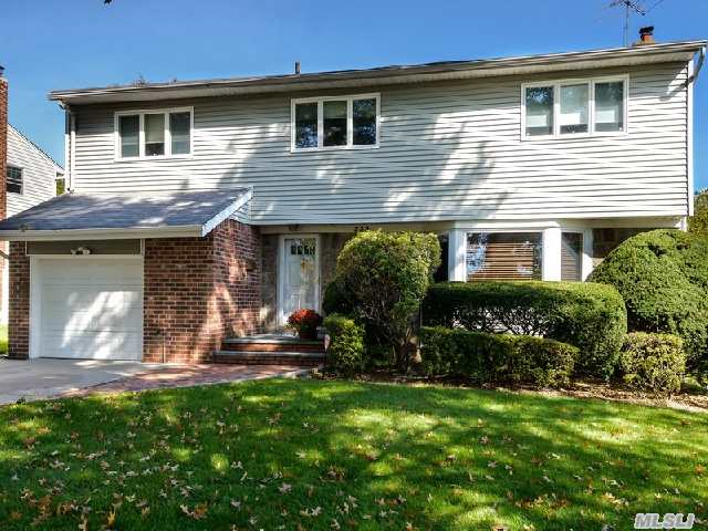 This 4 Bedroom 2.5 Bath Colonial Offers Beautiful Wood Floors,   Moldings,  Generous Rooms For Entertaining Guests Or Everyday Living.  The Country Kitchen Is Warm And Inviting. The Master Bedroom Has An En-Suite Bath And There Are 3 Additional Bedrooms All Located On The 2nd Floor.  Finished Basement.  Jericho School District #15.