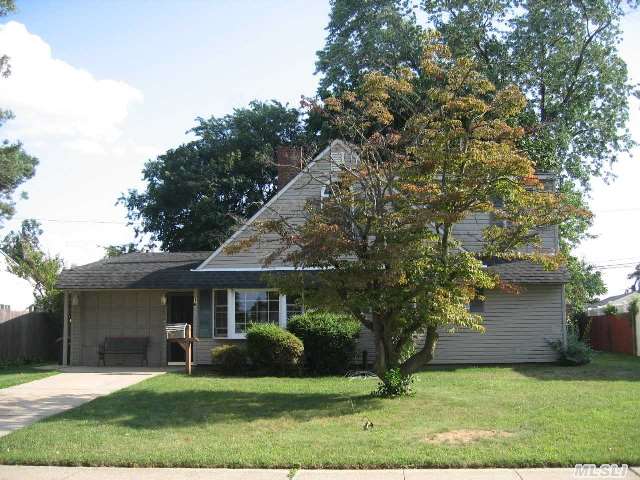 Wonderful Expanded Ranch Features 4 Bedrooms 2 Updated Full Baths,  Large Eat-In-Kitchen W/ Ceramic Floors New Cabinets,  Garage Partially Converted With Cathedral Ceiling,  And Newer A/C Unit. The Second Floor Bedrooms Are Spacious With New Flooring And Windows,  And Walk In  Attic For Storage. Newer Heating System 2000,  Roof Done 2005.