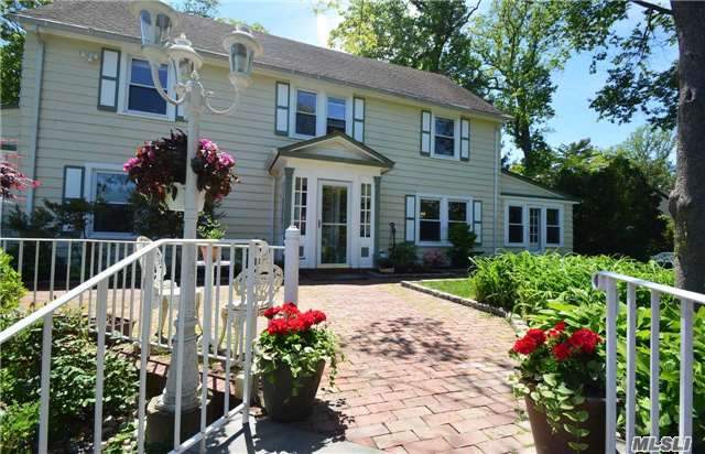 Charming Colonial On A Very Private Area. Large Flat Backyard, Large Living Room With Fireplace, Den, Huge Dining Room, Eat-In-Kitchen W Breakfast Area + Door To Flat Backyard. New Windows, New Baths, Beamed Ceiling