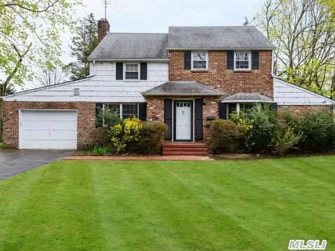 This Fabulous Colonial Is Nestled On An Interior Tree Lined Street In The Heart Of East Hills. Features Include A Free Flowing Floor Plan With Spacious Rooms And A Wood Burning Fireplace.  The Beautiful French Sliding Doors Lead To A Well Manicured Property With In Ground Sprinklers. This Home Is Convenient To The East Hills Park, Schools And Transportation.