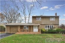 Beautiful 3Br Col. Open Airy 1st Flr Layout. Lg Den W/Slider. Huge, Flat Yard. Multi Lvl Deck. Mostly Wd Flrs Down & Upstrs. Nicely Sized Brs. Quiet Mid-Block Loc. Blue Ribbon Commack Schls.  Convenient To All Rdwys & Lirr. Easy Commute To Nyc. Boasts Igs, Alarm, Cac.  Dont Miss. Taxes W/Star Are $10,374.  