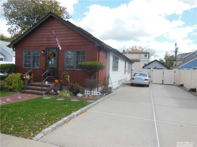 Beautiful Sundrenched Contemporary Two Bedroom, Chef's Kitchen With Granite And Center Island. Bright And Airy, Vaulted Ceilings, Den, Loads Of Closets, Multi-Car Driveway, Huge Rear Patio, Beautifully Landscaped, Gas Heat.