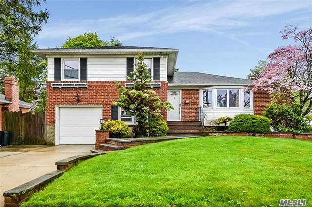 Large Split In One Of The Best Locations In Hicksville! Updated Kitchen And Bath. New 200 Amp Electric. Four Bedrooms. 2 Full Baths, Hardwood Floors. Central Air And Gas Heat And Gas Cooking. Den With Fireplace. Master Bedroom With Master Bath.