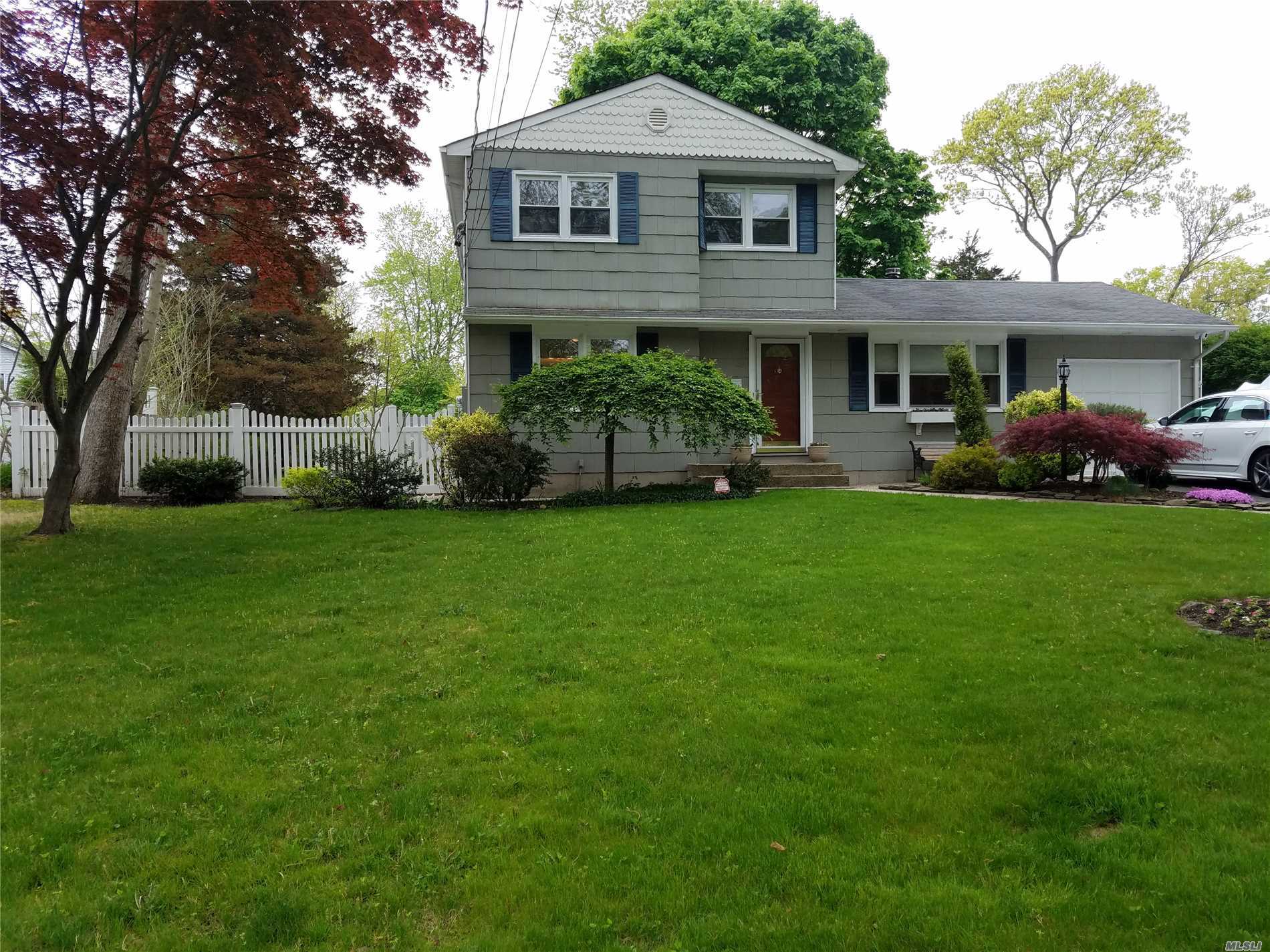 Beautiful Mint Condition Center Hall Colonial With Eat In Kitchen And Formal Dining Room. Gorgeous Den With Fireplace. Perfect For Entertaining. Sprinkler And Alarm System. Close To Transportation And Mall. Near Lake Grove Border. A Must See.