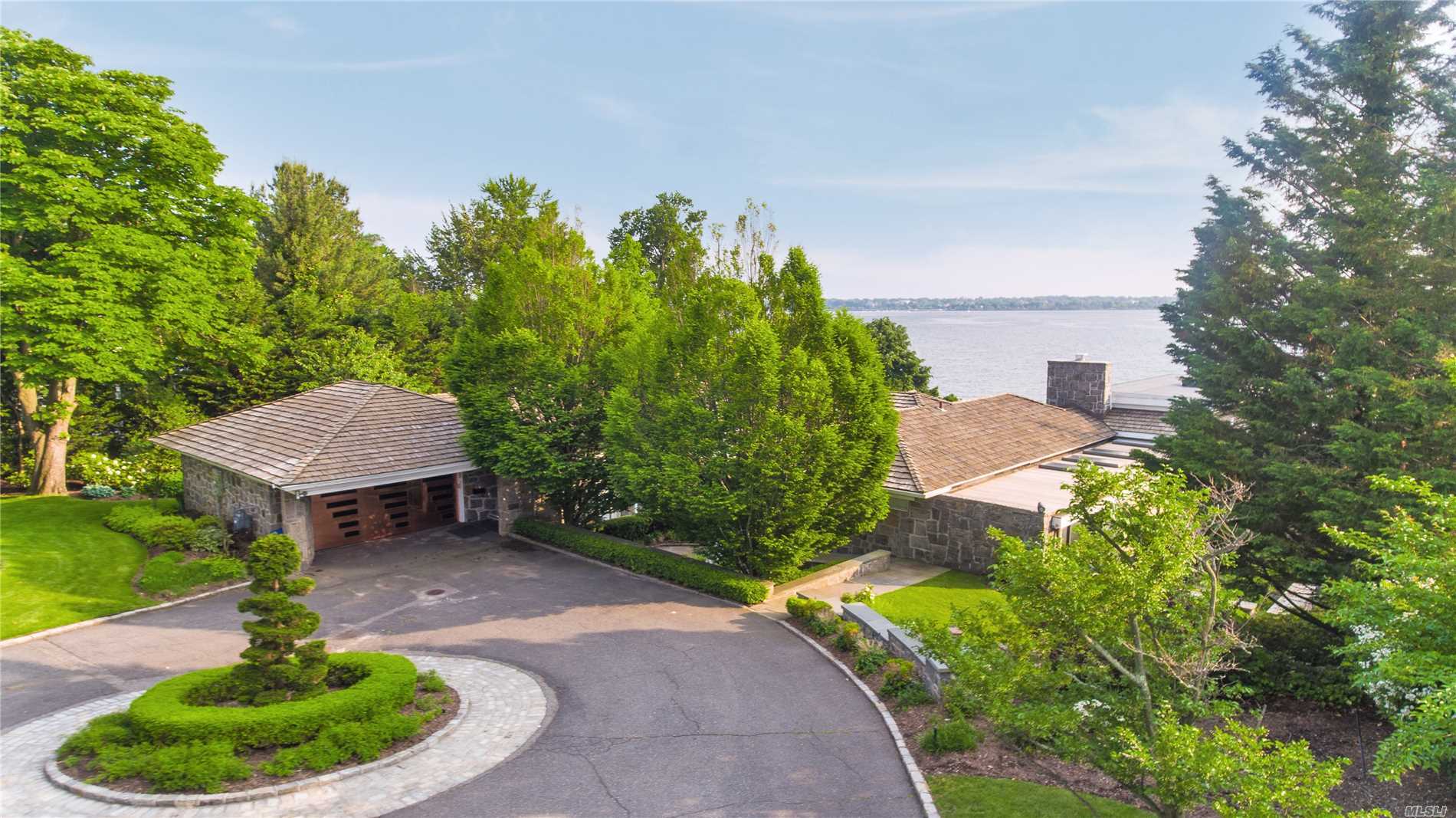 1.25 Waterfront Acre Retreat! This Gorgeous Modern Ranch is located in prestigious Village of Kings Point. An entertainer&rsquo;s Dream with Panoramic West Side water views of the Manhattan Skyline & City Bridges. An Oasis built by renowned architect. Spectacular sunsets, luscious green lawns and specimen plantings. This Gem features a Master Suite, 3 Additional Bedrooms, 4 Full Baths and 2 Half Baths, Lovely Eat-in-Kitchen, Spacious Living room with fireplace, Full Generator, Pool & so much more