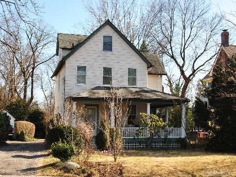 Sun Drenched Colonial With Wrap-Around Porch Sitting On Large, Lush Grounds In The Village Of Great Neck. There Are Four Bedrooms,Plus An  Extra Bedroom Room And Den On The Lower Level.This Charming Home Has A Formal Dining Room, A Living Room With Lots Of Windows And A Large Open Granite Eat-In Kitchen Overlooking The Patio And Huge Back. 