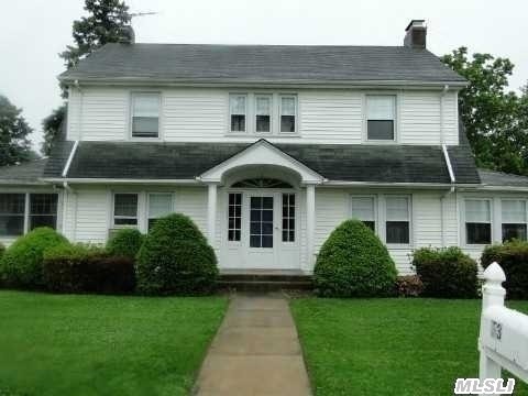 Dutch Colonial,  2100 Sq Ft Home,  3 Bedroom,  Eik,  Large Livingroom W/Fireplace, Formal Dining,  Office,  Sunroom,  Part Finished Basement. High Ceilings,  Updated Baths,  New Heat System,  6 Zone Inground Sprinklers,  2 Car Detached Garage,  Large Property 100X136. Must See To Appreciate