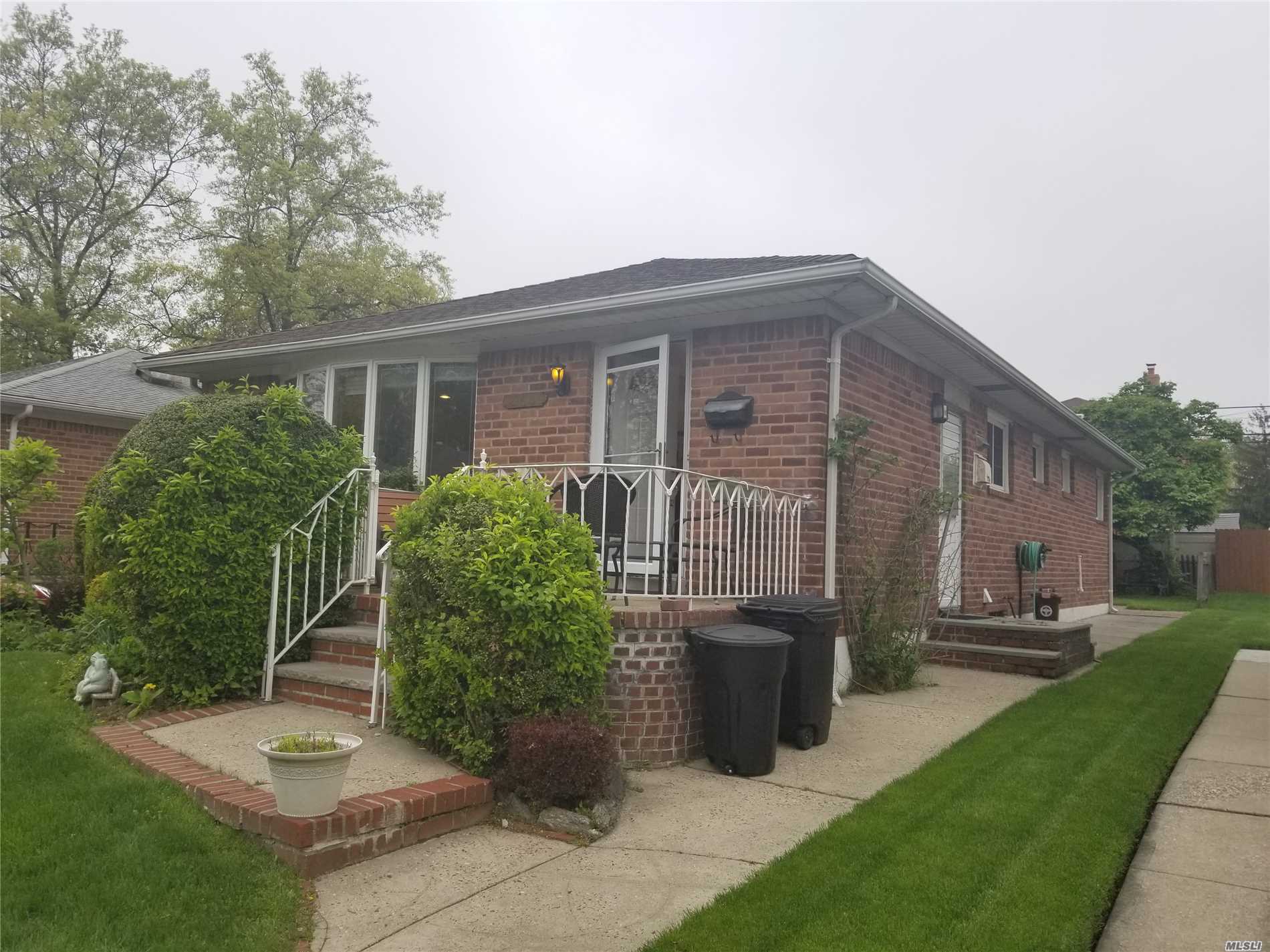 Very charming whole brick ranch, south faced bright living room with bay window, hardwood floor thru-out, professional landscaping, quiet & convenient location, bus Q27 to Flushing, QM#5 to NYC, best school dist. #26, P.S.#188, I.S.74, super dry basement, very well maintained house, backyard with brick patio brick, 1 block from Alley Pond Park, ....so great to live near to park, shower bathroom in the basement is a gift, your family will love this home sweet home!....