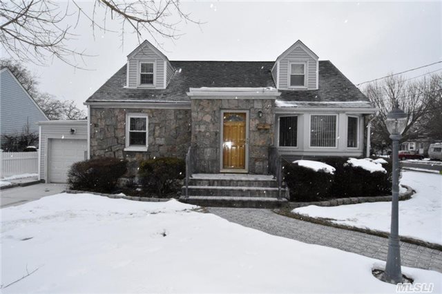 Lovely Cape Located On Very Quiet Block. Corner Property W/ Large Backyard. Beautifully Landscaped, Pavers, And Bluestone. 8 X 10 Jacuzzi, Great For Entertaining. Hardwood Floors Throughout. Master Bedroom With Walkin Closet. Jacuzzi Tub. Large Eik And Much More!!!